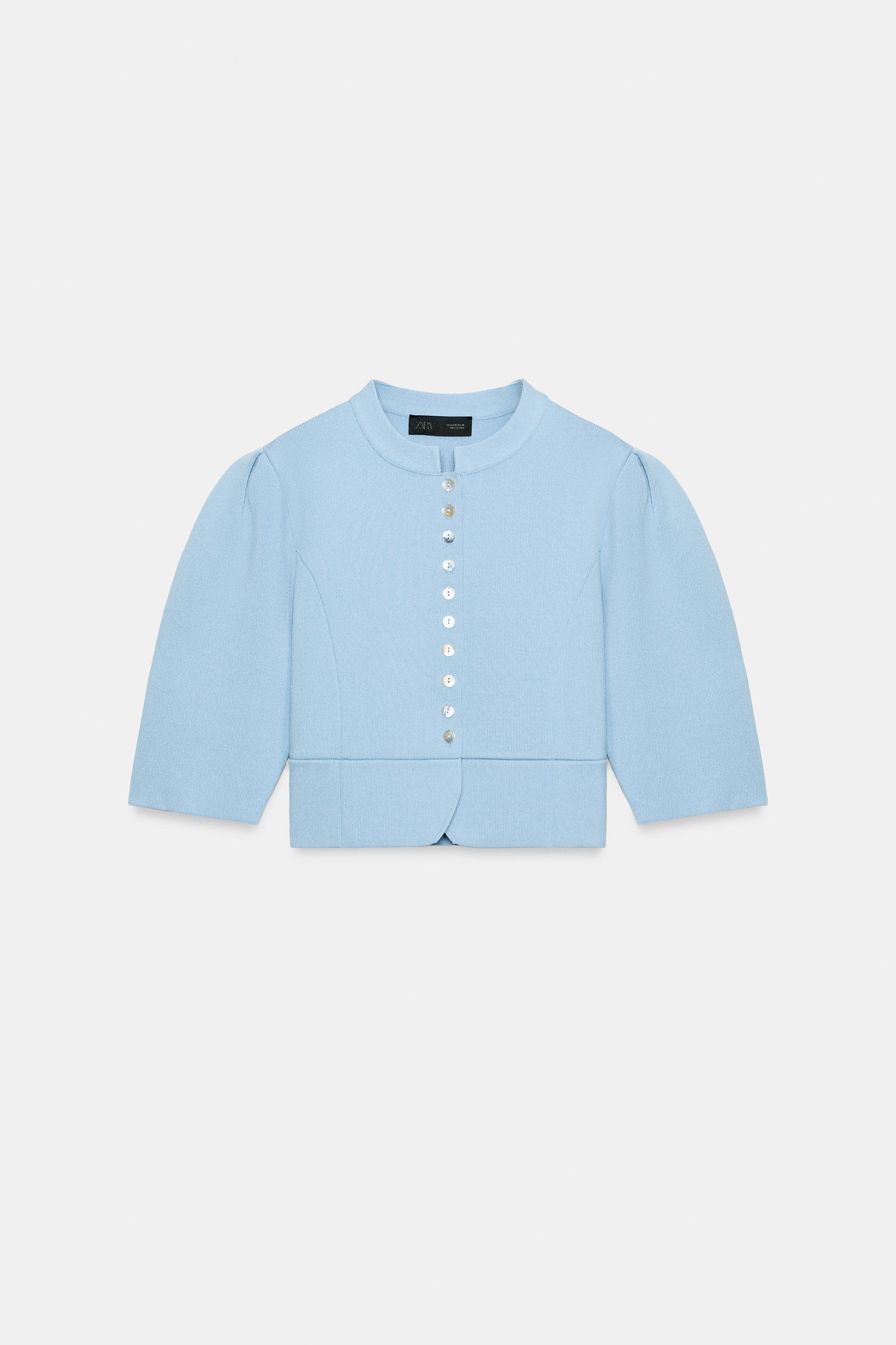GILET EN MAILLE À MANCHES BOUFFANTES